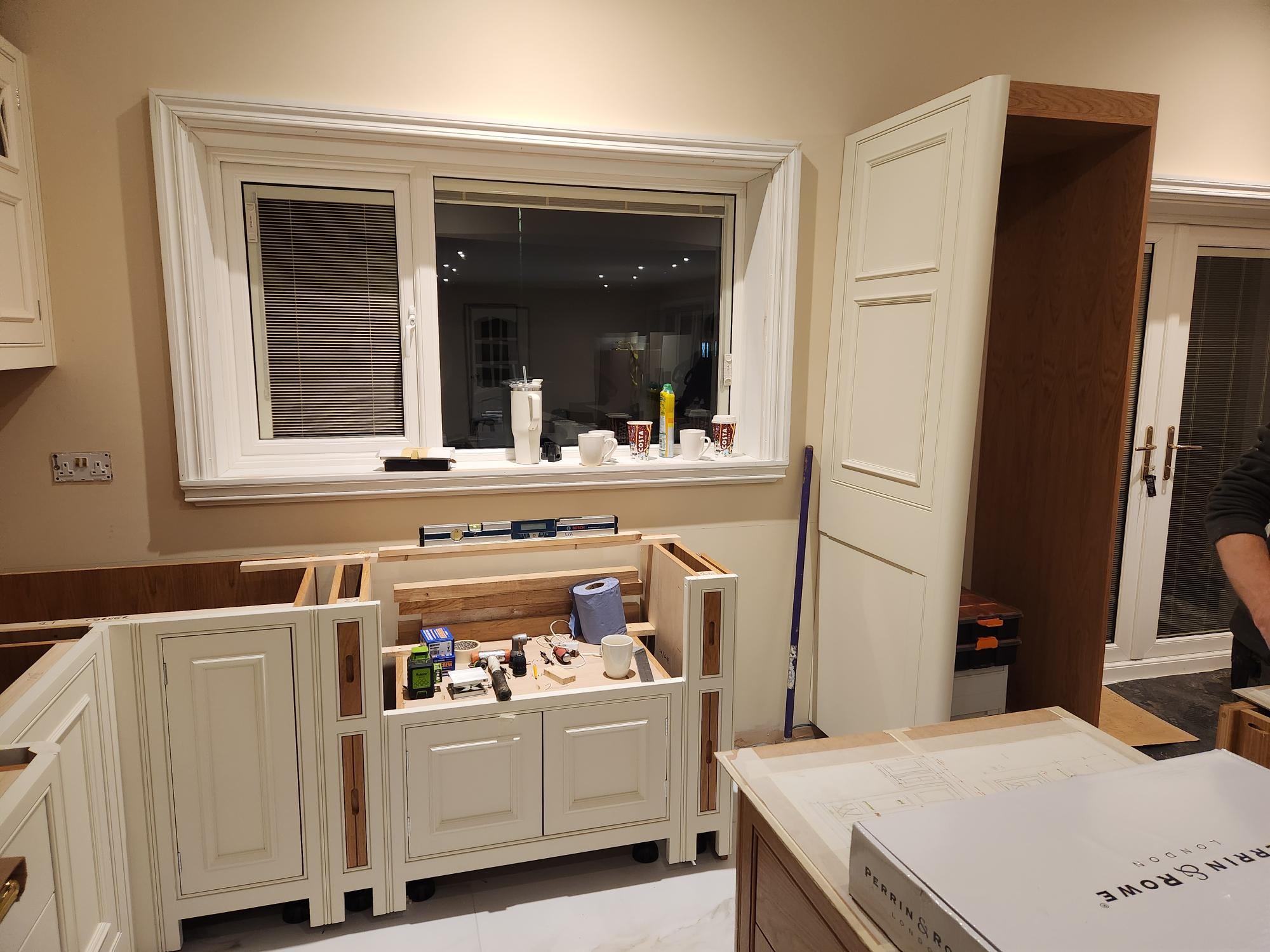 Kitchen sink units and tall pantry cupboard installation