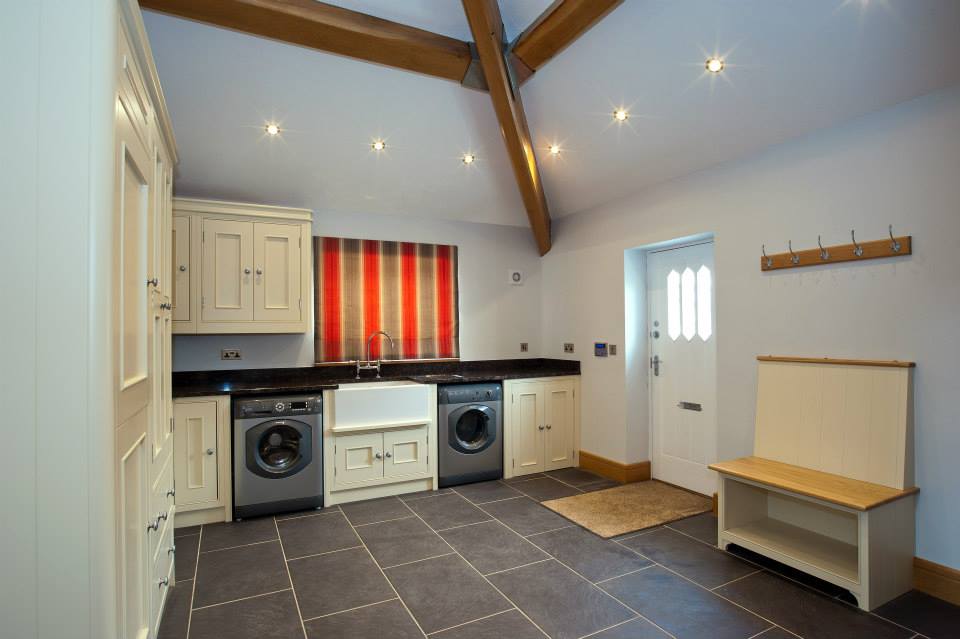 Utility room with fitted cabinetry and Belfast sink